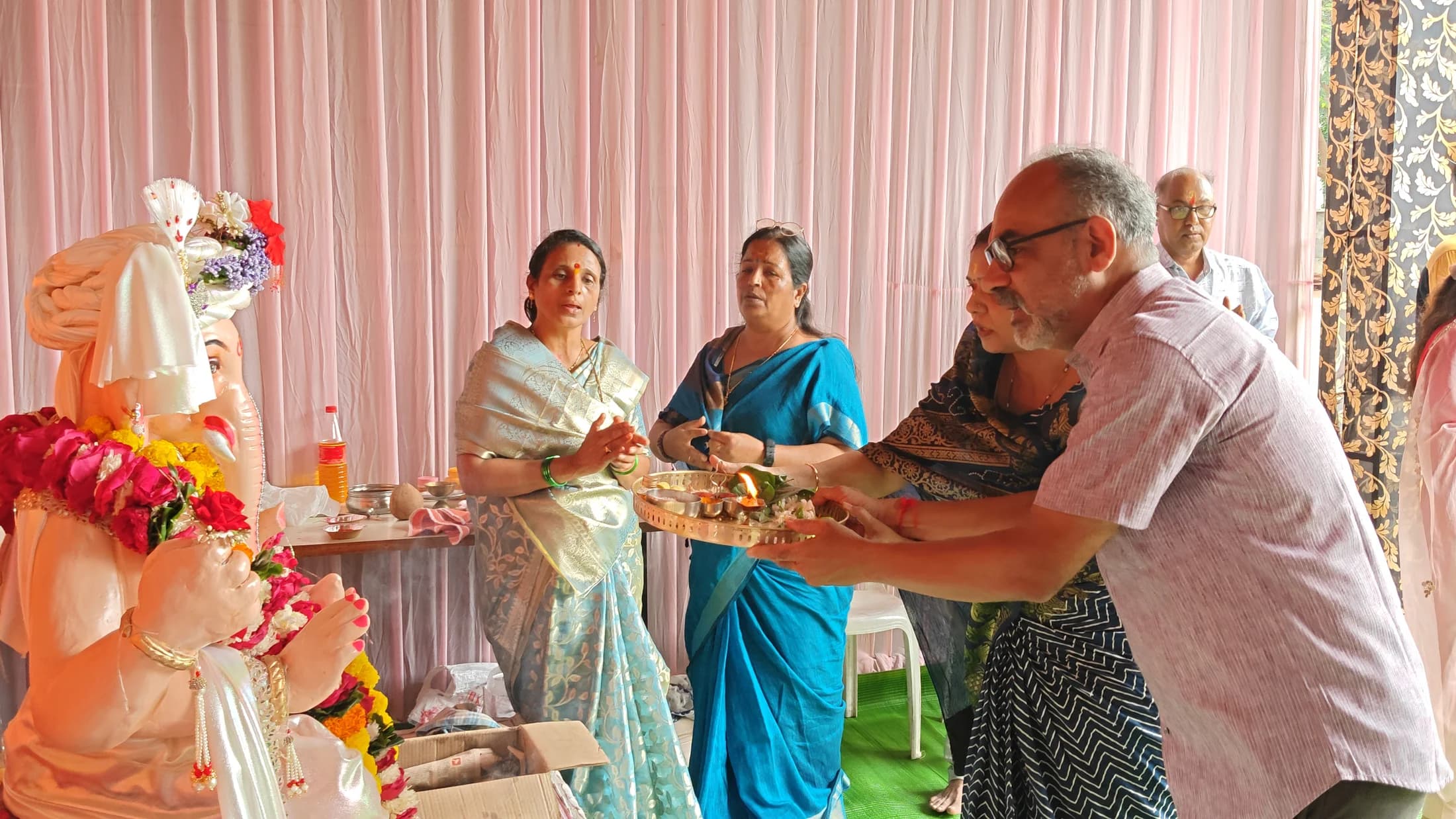 Aarti flame offered before Lord Ganesha
