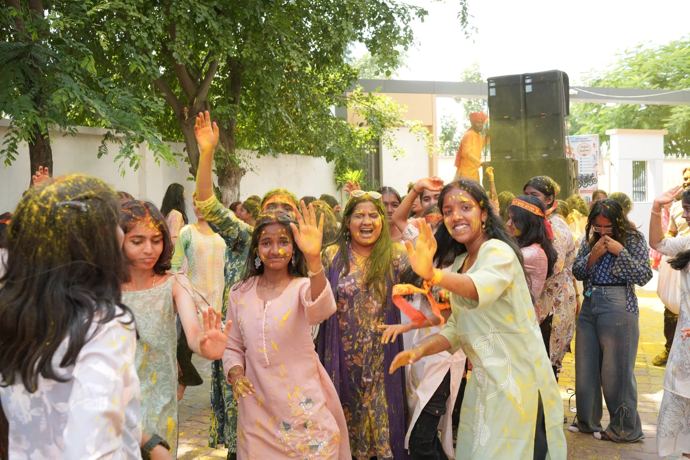 Students dancing together during the festive Ganpati celebration