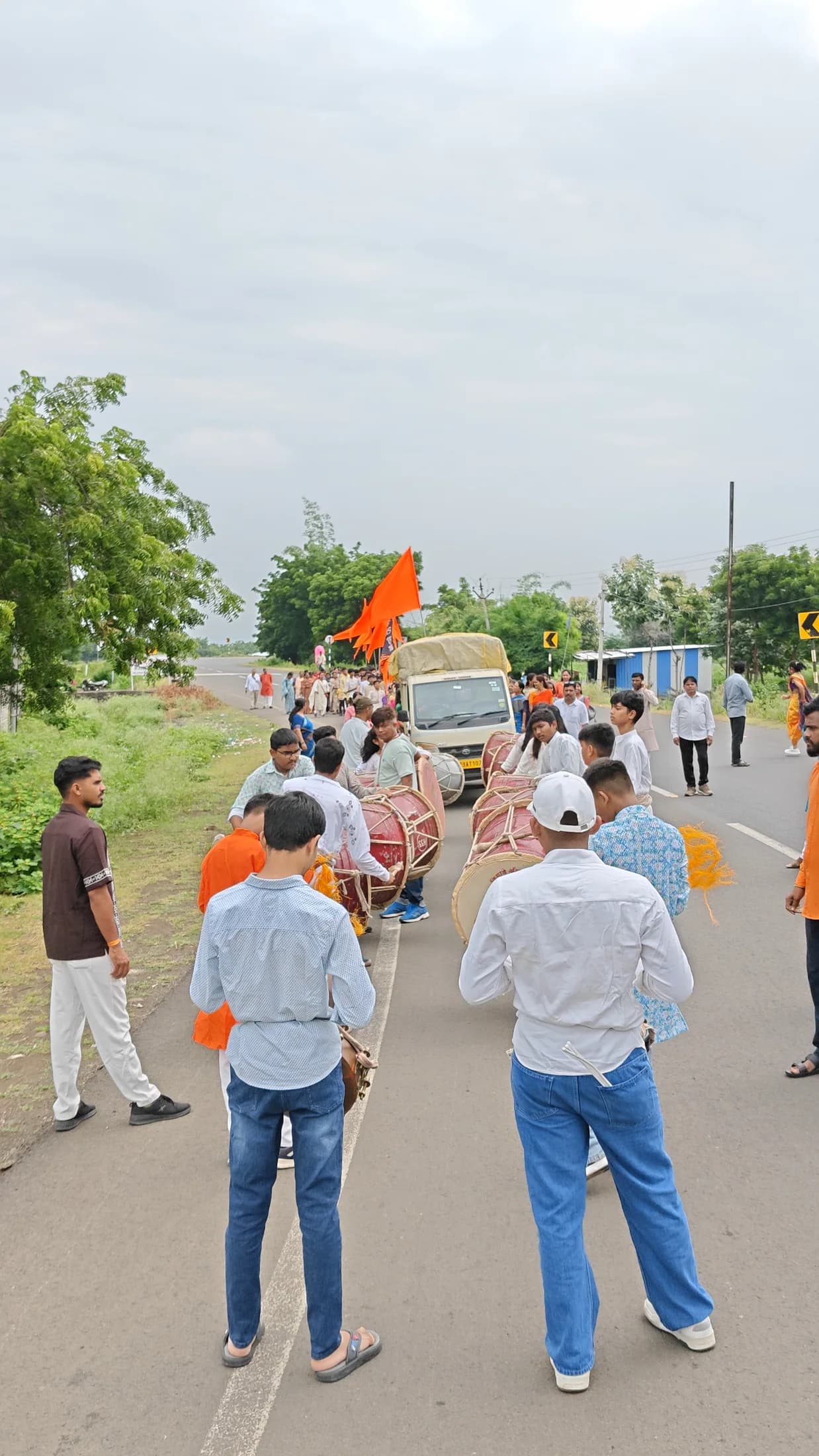 Dhol players leading the Ganpati Visarjan procession on the road