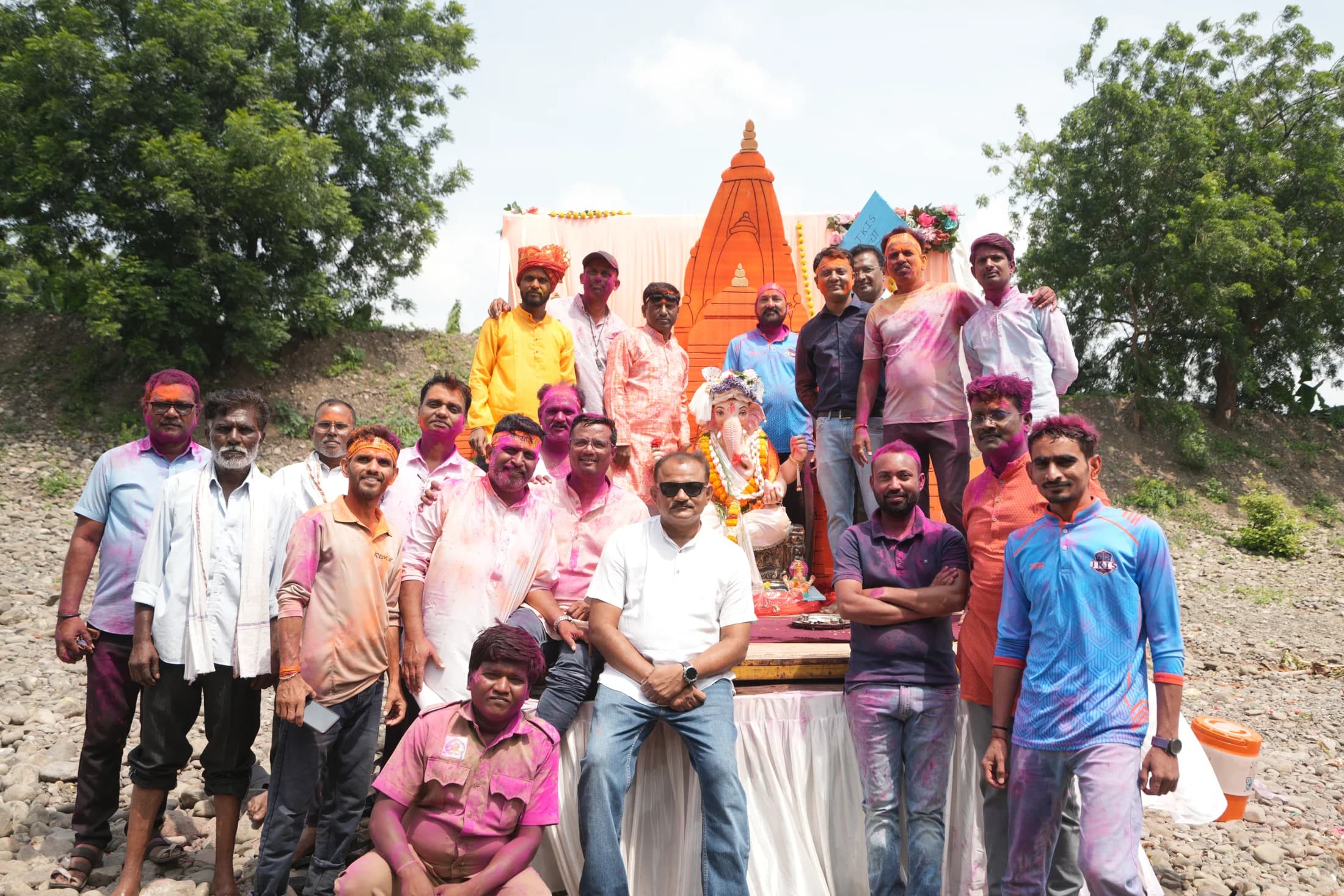 Community gathered with Ganpati idol at the riverbank for Visarjan