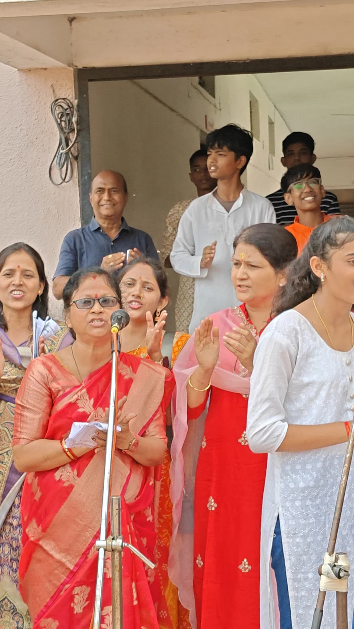 Women singing together during devotional celebration