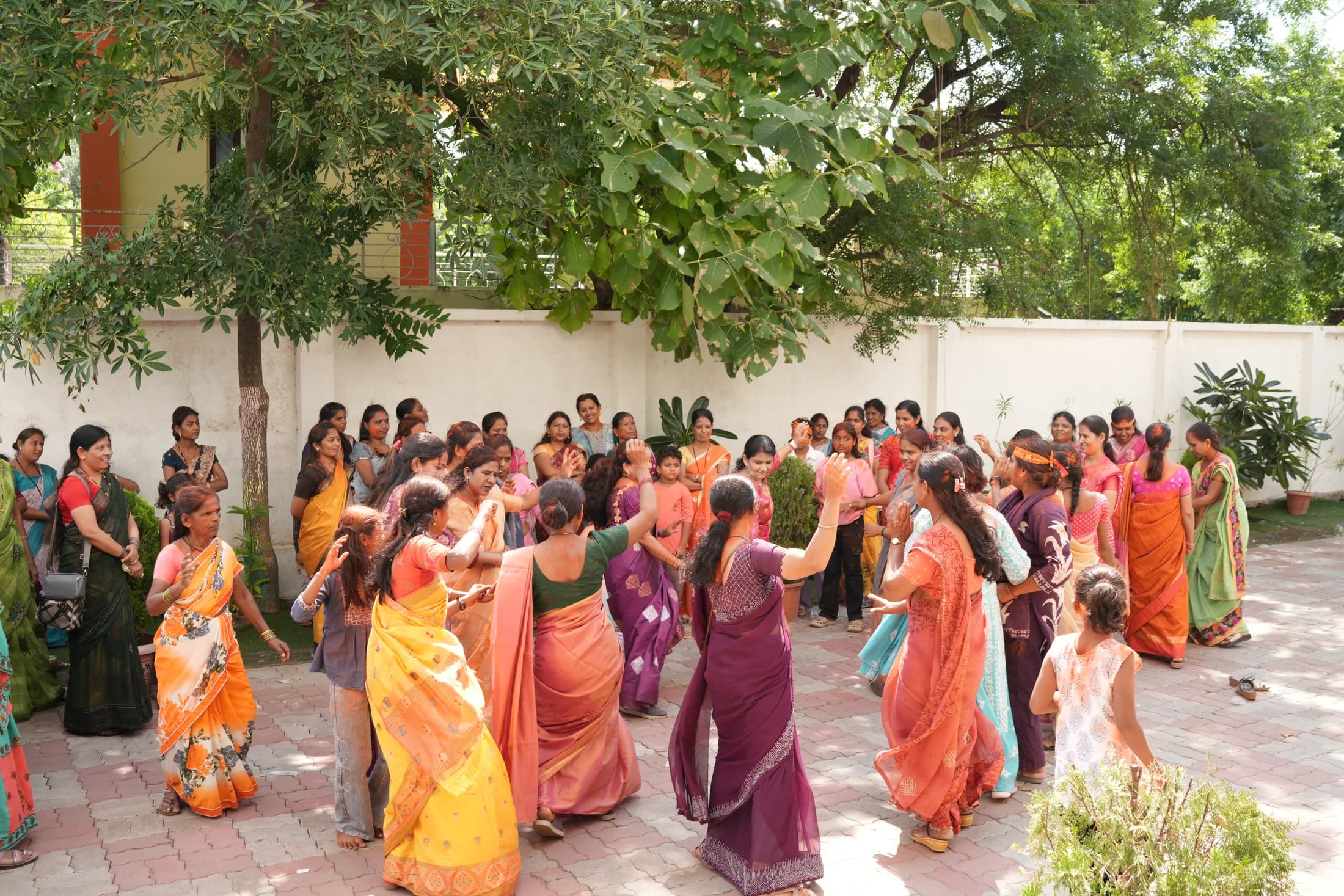 Women celebrating together during the campus procession