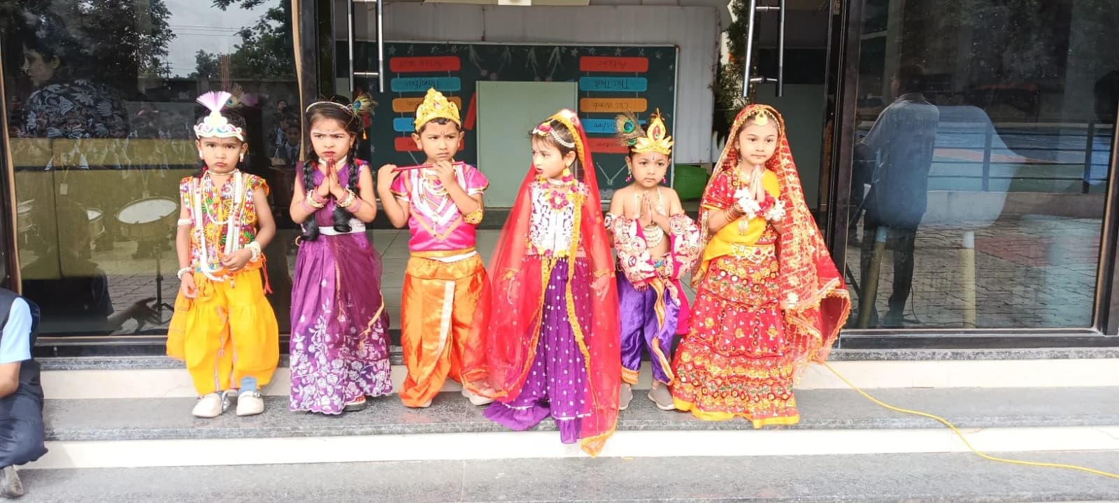 Little Krishnas and Radhas dressed in festive attire at Jet Kids